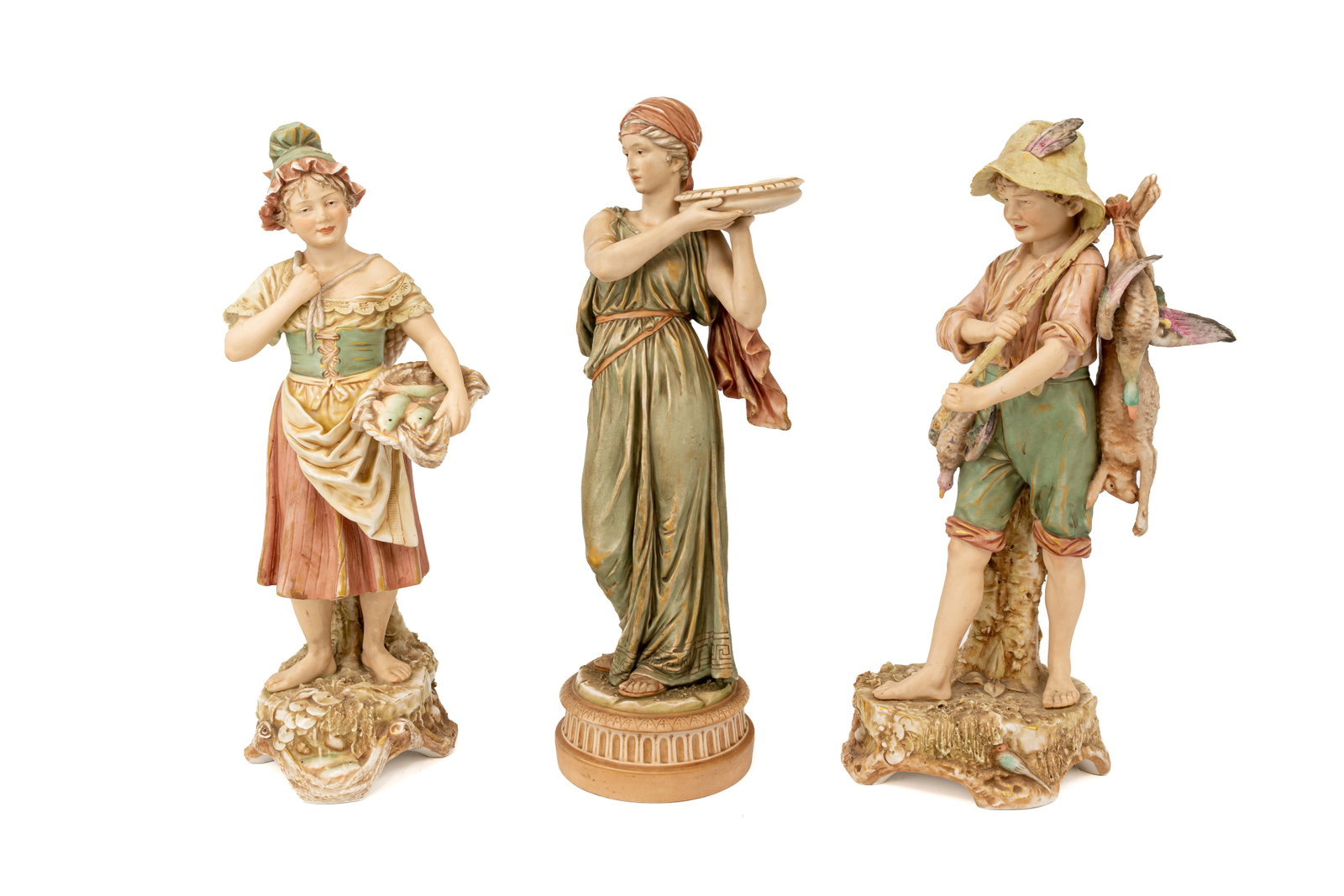 A composed lot of three antique Bohemian Royal Dux figural porcelain figurines: A composed lot of three antique Bohemian Royal Dux figural porcelain figurines. First half of the 20th century. Condition: one figure shows some damages, a condition report is available upon request. 