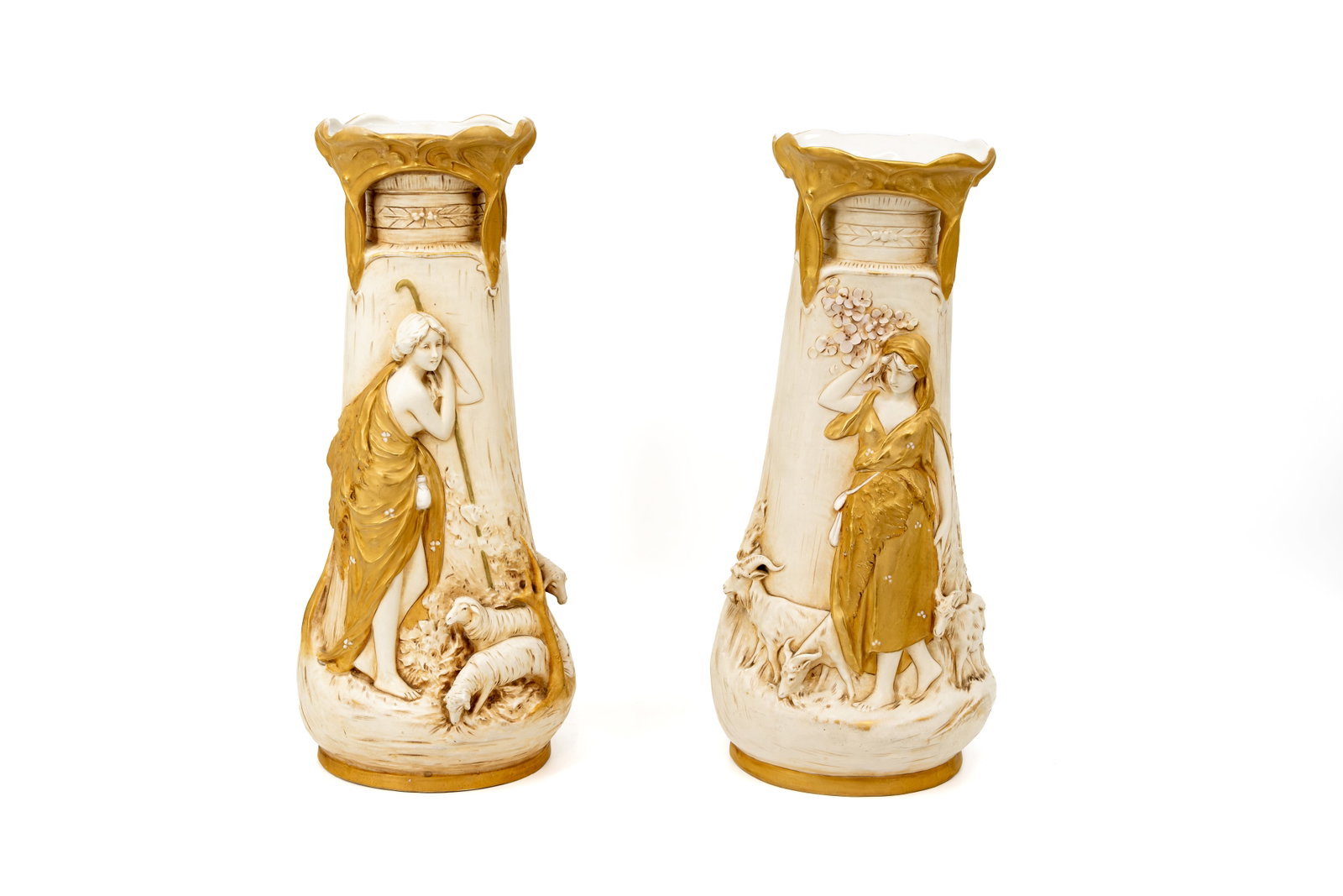 A pair of Bohemian Art Nouveau Royal Dux porcelain figural vases: A pair of Bohemian Art Nouveau Royal Dux porcelain figural vases decorated with shepherdesses. Marked and 20th Century. H: 41 cm
