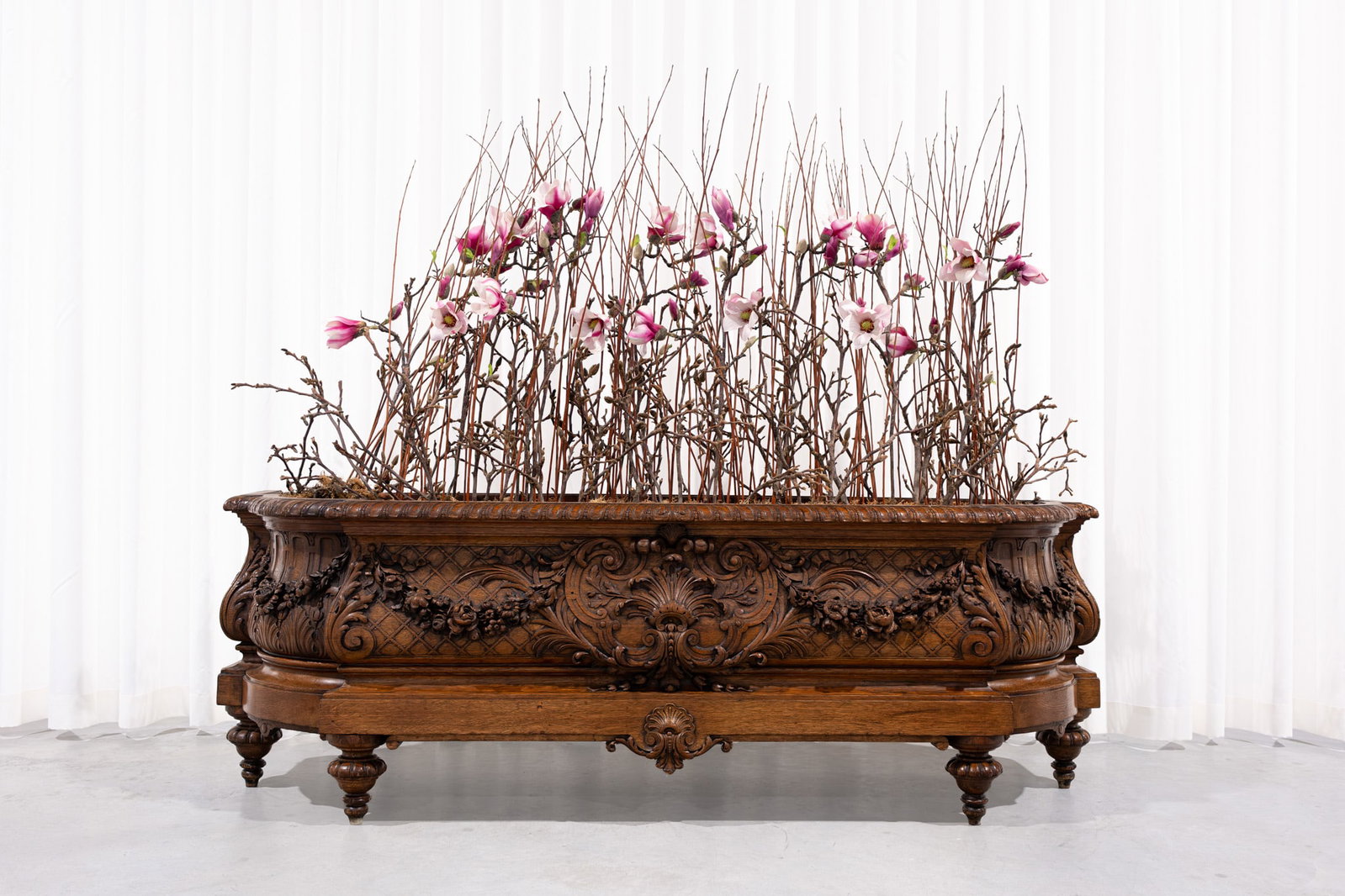 An exceptional and imposing rococo style richly decorated carved oak planter: An exceptional and imposing rococo style richly decorated carved oak planter. 19th century. H: 62 - W: 182 cm