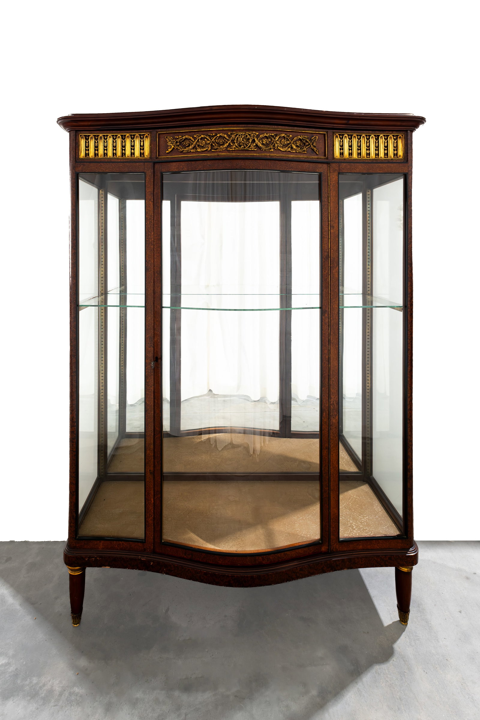 A French and antique Louis XVI style display cabinet with gilt bronze mountings: A French and antique Louis XVI style display cabinet with gilt bronze mountings and walnut veneer. The top and glass parts are demountable. Late 19th century. H: 180 - W: 130 - D 50 cm