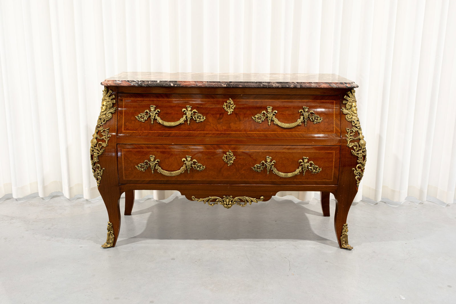 A 20th century Louis XV commode with two drawers, a marble top and brass mountings: A 20th century Louis XV commode with two drawers, a marble top and brass mountings. Circa 1970s. H: 89 - W: 138 - D: 55 cm