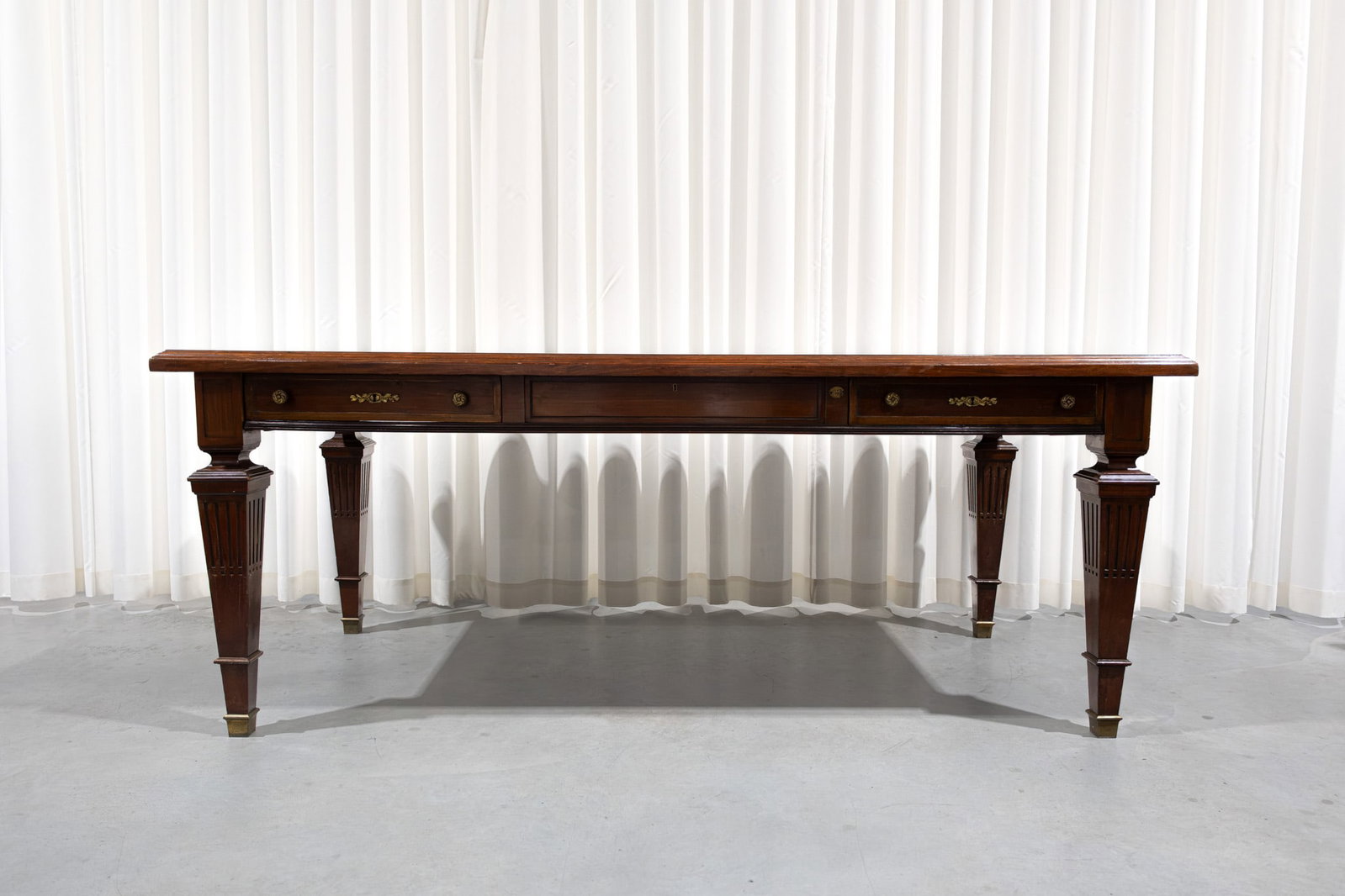A large and antique rectangular neoclassical style marquetry wooden desk table: A large and antique rectangular neoclassical style marquetry wooden desk table with drawers. 19th century. H: 80 - W: 209 - D: 100 cm