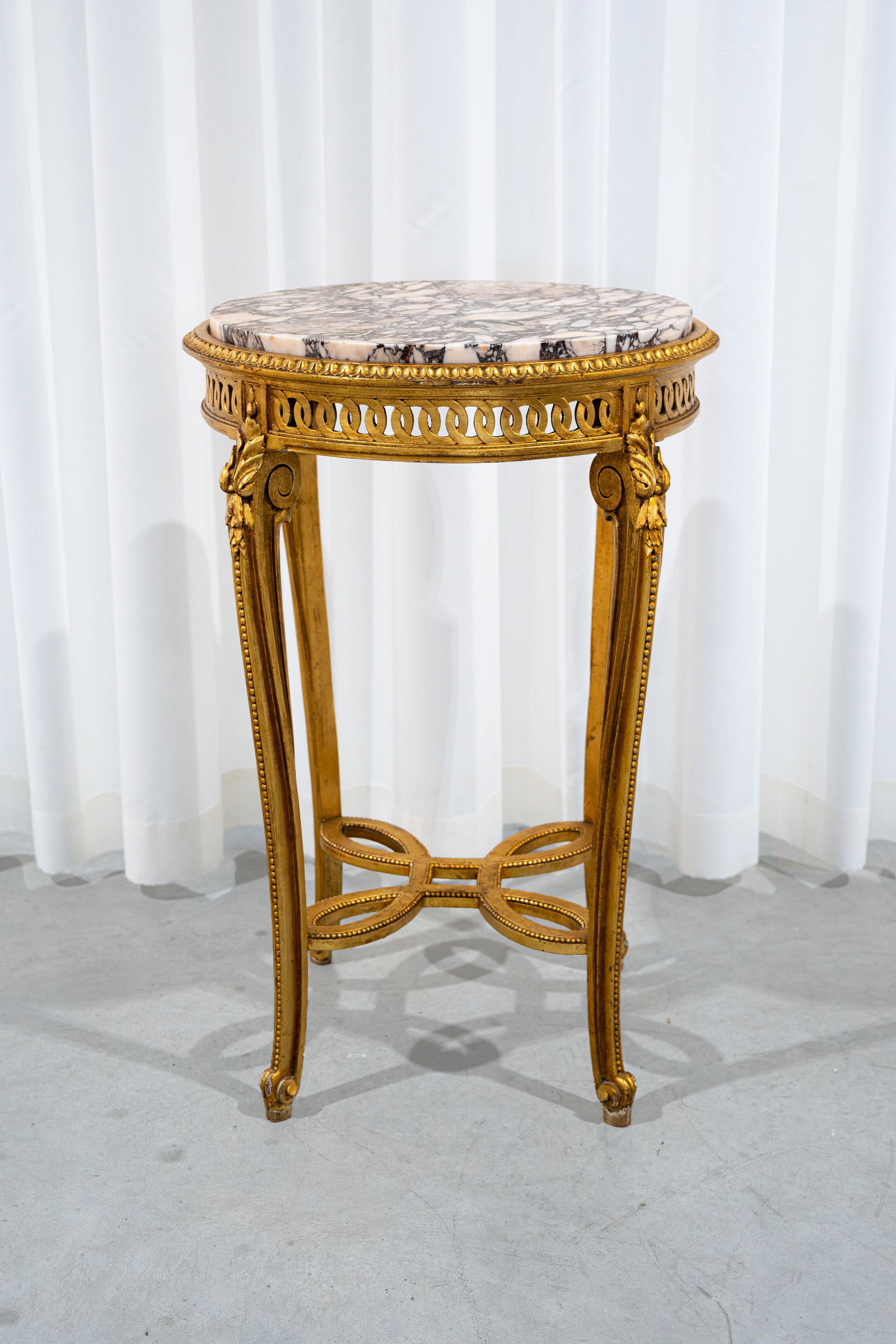 A Louis XVI style polychrome openwork gilt wood side table with a marble top (1 of 6)