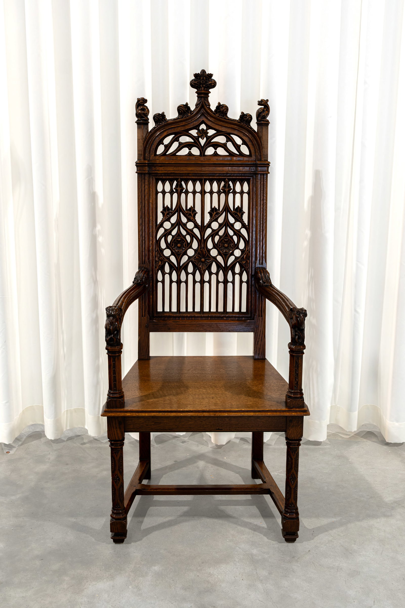 An antique Neo-gothic richly decorated carved wooden armchair (1 of 8)