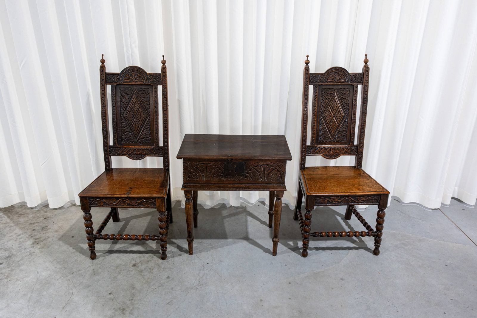 A lot of two antique Flemish carved oak chairs, together with a small side cabinet (1 of 7)
