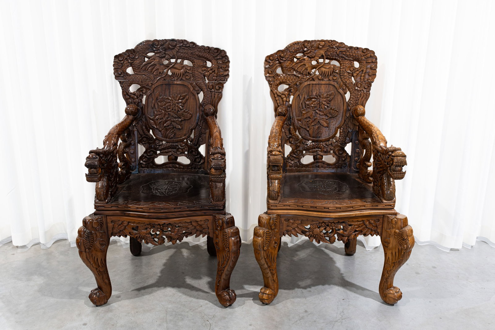 A lot of two imposing Japanese richly carved and openwork hardwood armchairs (1 of 13)