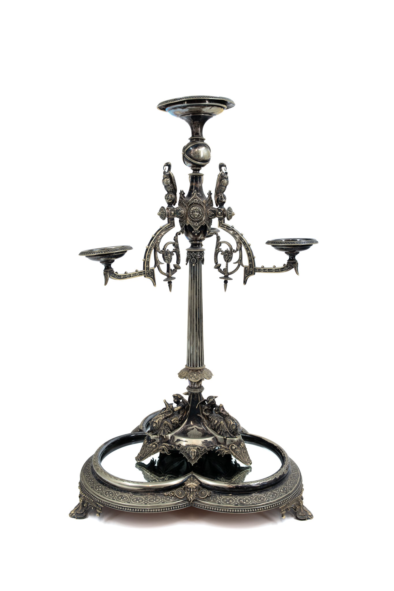 A large and antique richly decorated silver plated candelabra centerpiece on a mirrored base (1 of 20)