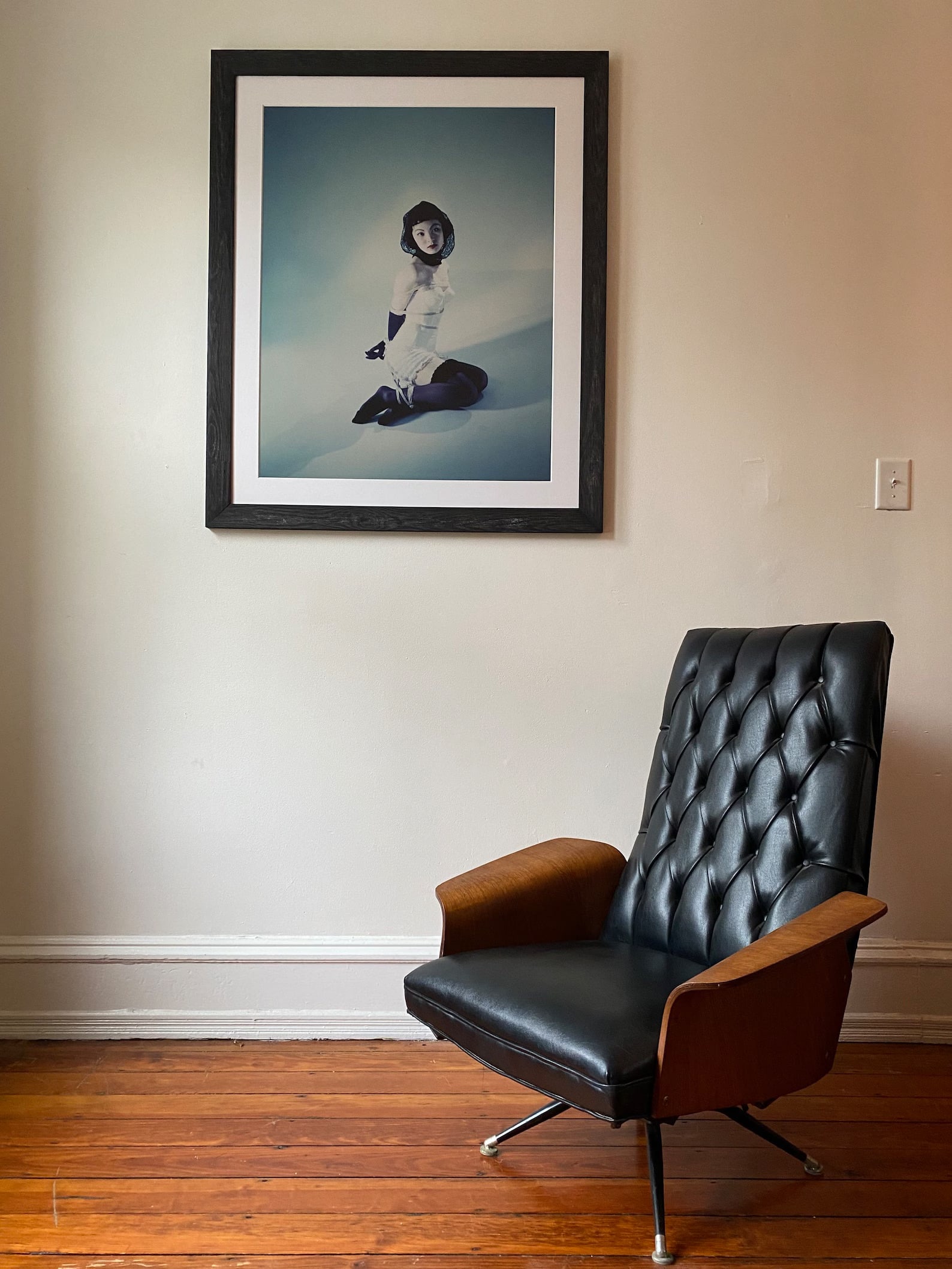 George Mulhauser for Plycraft Lounge Chair, Black Upholstery: Mid-century modern lounge chair designed by George Mulhauser for Plycraft, circa 1960s. Features black tufted leatherette upholstery with molded walnut plywood shell and swivel metal base.