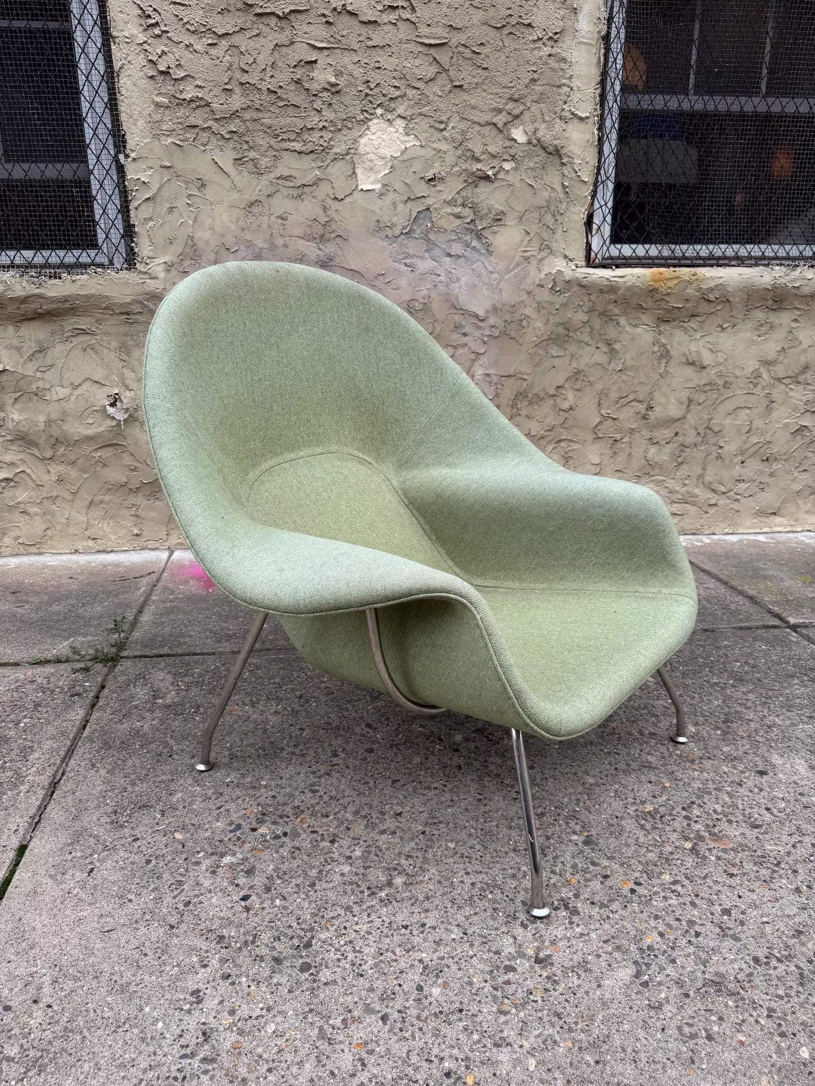 Eero Saarinen for Knoll Womb Chair, Pale Green Upholstery: Iconic Womb Chair designed by Eero Saarinen for Knoll, circa mid-century. Sculptural molded form in pale green upholstery on metal frame designed for relaxed enveloping comfort. A landmark piece of mo