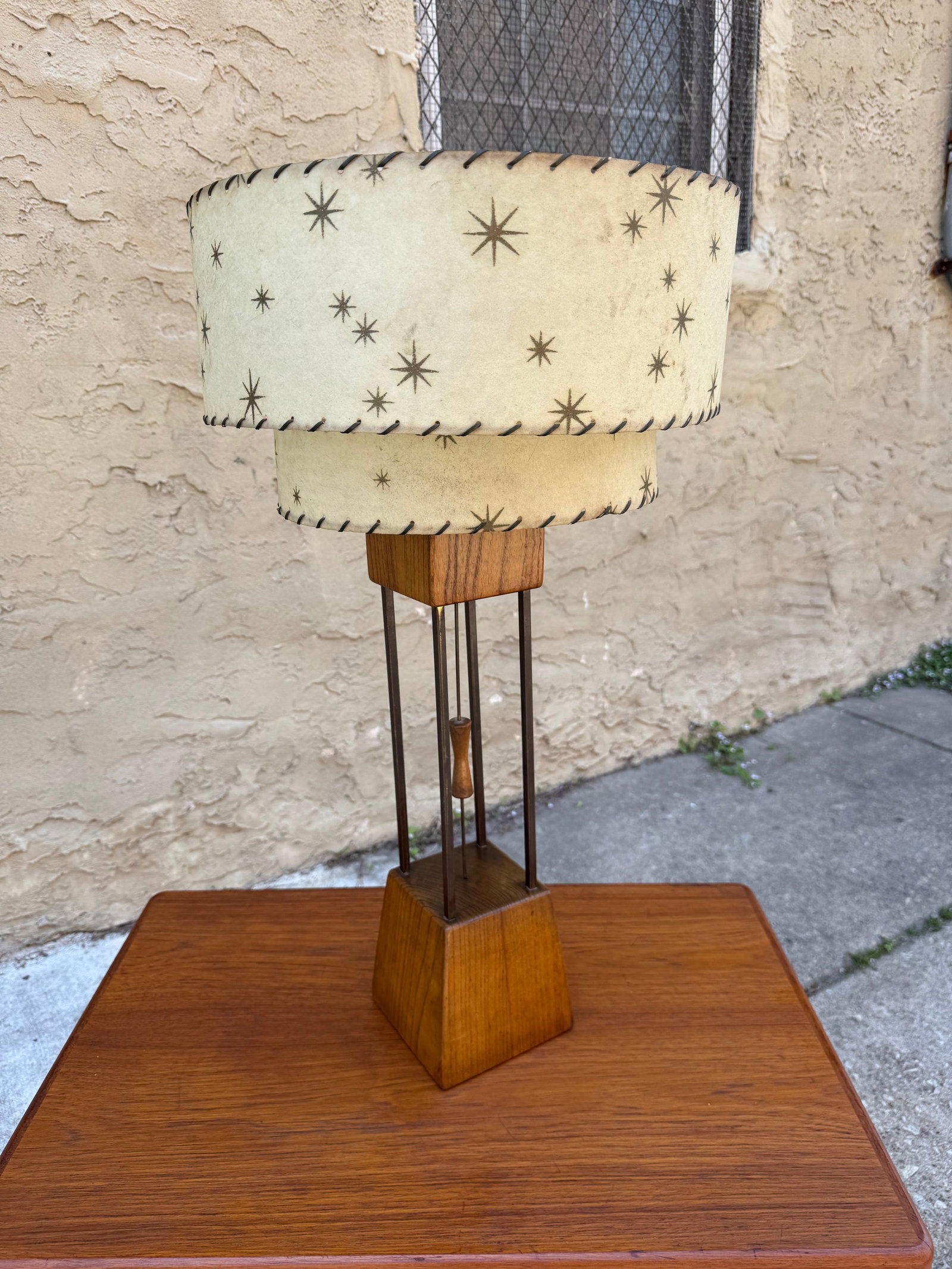 Vintage Mid-Century Modern Walnut & Brass Table Lamp Base: Striking mid-century modern table lamp base featuring a sculptural open “cage” structure with solid walnut top and bottom blocks connected by vertical brass rods. A central wood-and-brass hour