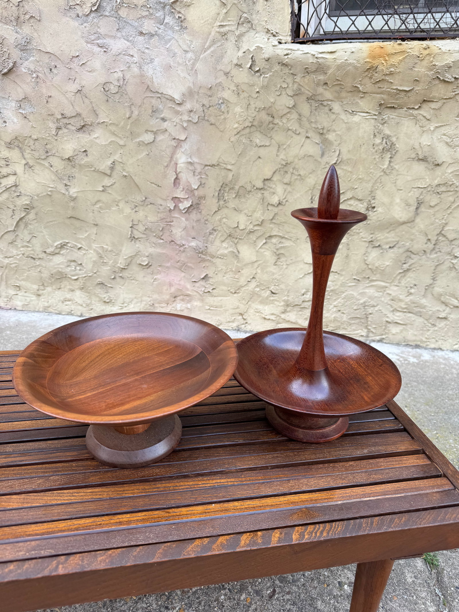Mid-Century Modern Scandinavian Teak Entertaining Set: Exceptional two-piece Scandinavian modern teak set dating to the 1960s, crafted from solid hand-turned teak with warm organic tones and clean Danish modern lines. The set includes two sculptural pedes
