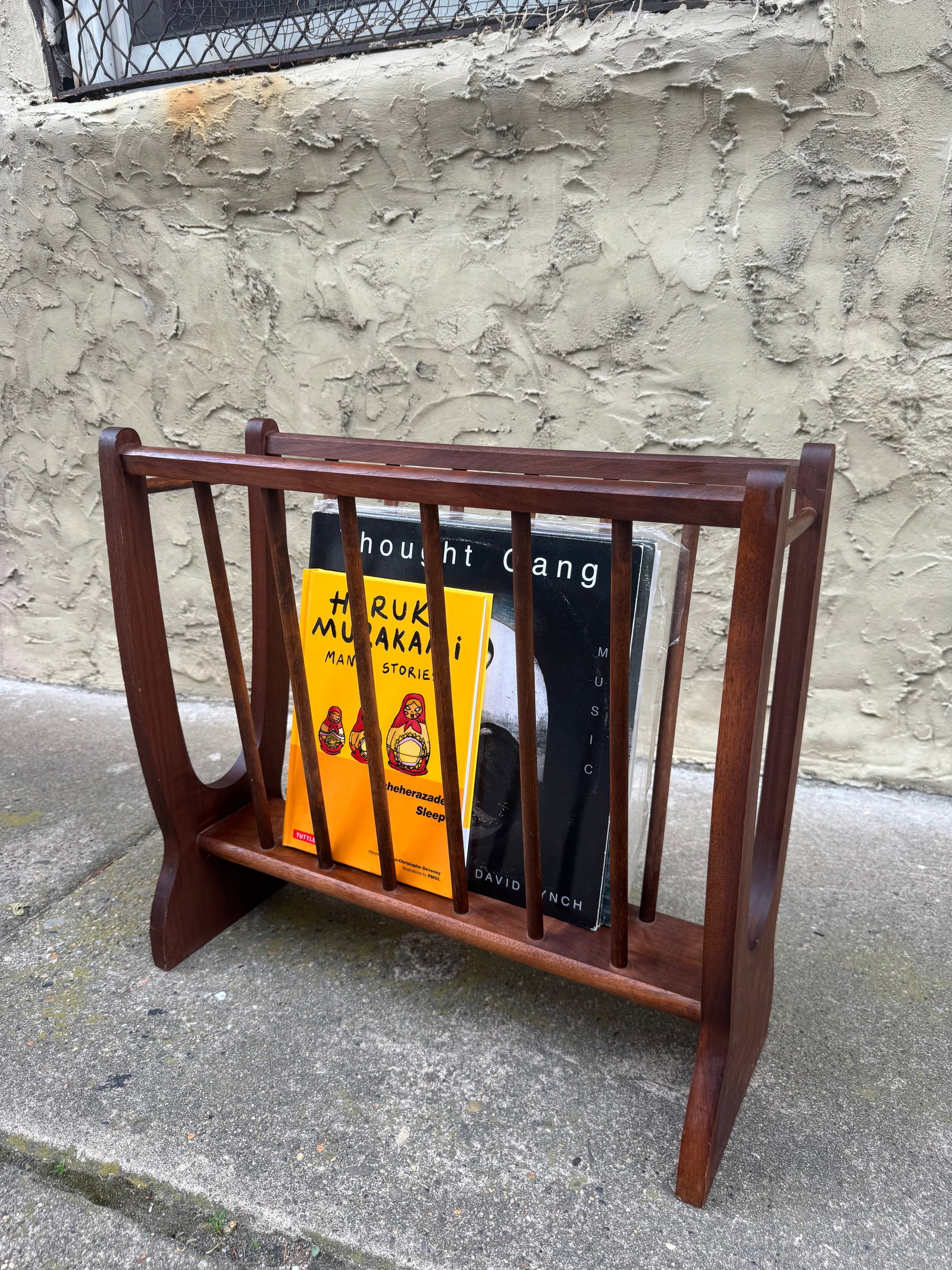 Vintage Mid Century Modern Atomic Spindle Magazine Rack: Vintage mid-century modern magazine rack by Scheibe featuring an “atomic” spindle-slat design in solid teak or walnut. Sculptural side panels and tapered slats create a clean Danish modern sil