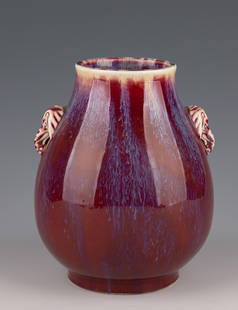 Qing Dynasty Chinese Flambe Vase with Elephant-Head Handles: Chinese Flambe Vase with Elephant-Head Handles" Introduction:
Embark on a journey through time with this captivating Chinese flambe vase, a testament to the artistry and craftsmanship of