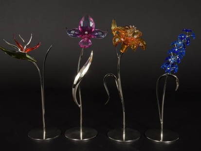 Swarovski Crystal Set of 4 Exquisite Floral Sculptures: "Swarovski Crystal Paradise Flowers Collection: Set of 4 Exquisite Floral Sculptures" Introduction:
Indulge in the timeless elegance of Swarovski craftsmanship with this exquisite set of