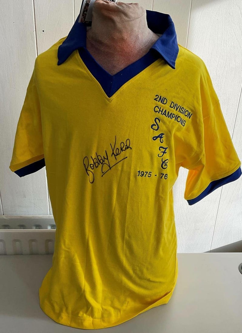 Bobby Kerr Signed Sunderland 2nd Division Champions 1975-76 Retro Shirt: Retro shirt signed by Bobby Kerr, commemorating Sunderland's 2nd Division Championship win in the 1975-76 season. A piece of Soccer Memorabilia celebrating a significant achievement in the club's hist