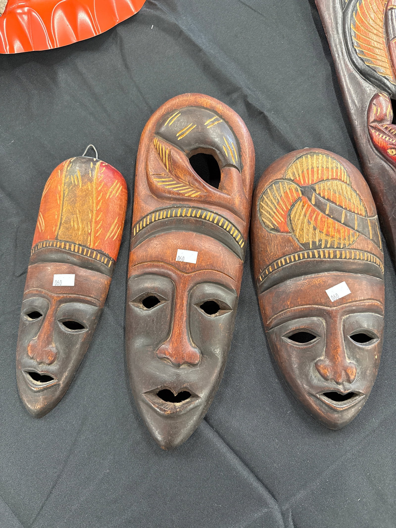 4 X WOOD CARVED AFRICAN MASKS: 4 X Wood Carved African Masks. Mask 1: 10 inches long. Mask 2: 11 inches long. Mask 3: 14 inches long. Mask 4: 24 inches long.