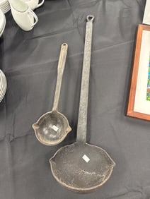 2 LARGE CAST IRON SPOONS