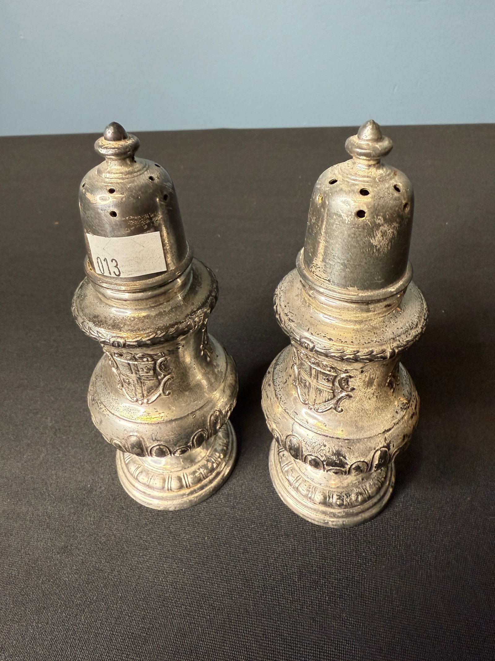 ANTIQUE STERLING SILVER SALT AND PEPPER SHAKER: Pair of sterling silver salt and pepper shakers.