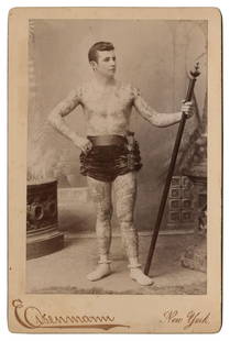 Cabinet Card of Tattooed Man George Karlavagn (New York, ca. 1890): Cabinet Card of Tattooed Man George Karlavagn (New York, ca. 1890) Karlavagn, depicted here in full view holding a staff, was one of the first attractions tattooed by Samuel O’Reilly with his