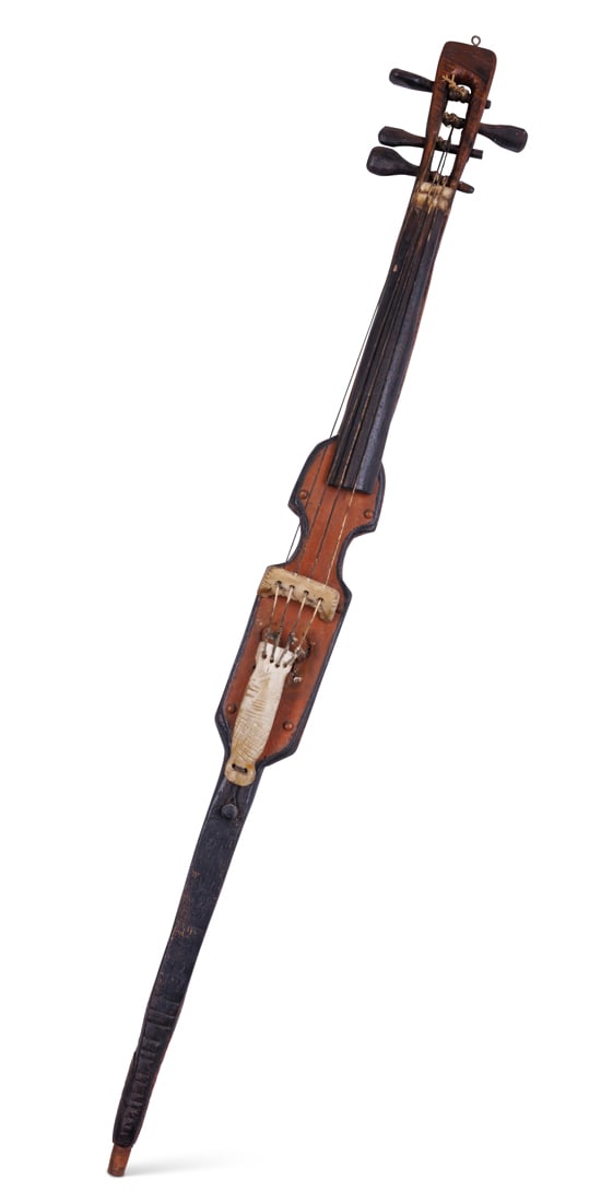 Cannibal Musical Instrument by Tattoo Artist Gus Wagner (Kansas, ca. 1925) 2 1/2 x 35 in. (x 6.4 x: Cannibal Musical Instrument by Tattoo Artist Gus Wagner(Kansas, ca. 1925)Hand-carved and painted stringed instrument by Gus Wagner (1872-1941), probably Clements, Kansas, ca. 1925. One of several unus