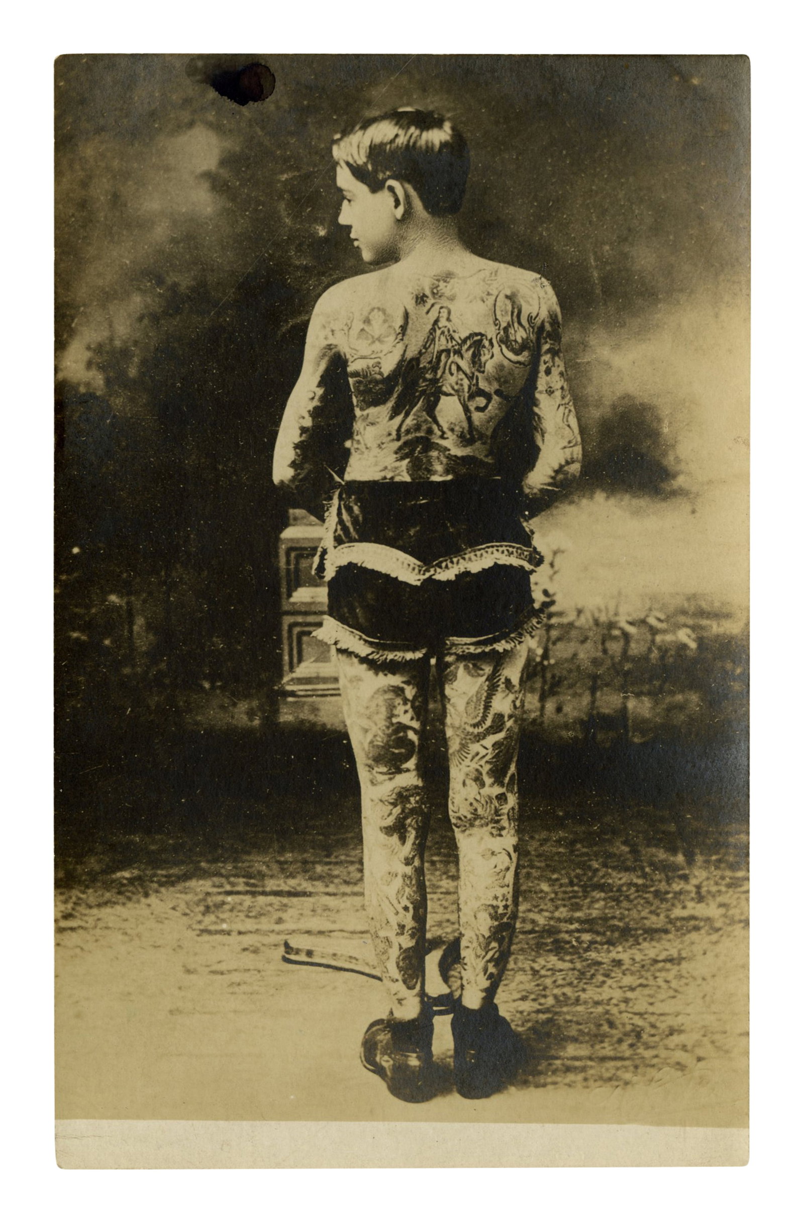 Photo Postcard of Tattooed Boy Andy Stuertz [Bowery - Tattoo - RPPC] (New York, ca. 1920) 5 1/2 x 3: Photo Postcard of Tattooed Boy Andy Stuertz [Bowery - Tattoo - RPPC] (New York, ca. 1920) Depicting Andy Stuertz (1893-1962), tattooed by famed Bowery artist Charlie Wagner (1876-1953) when thirteen o