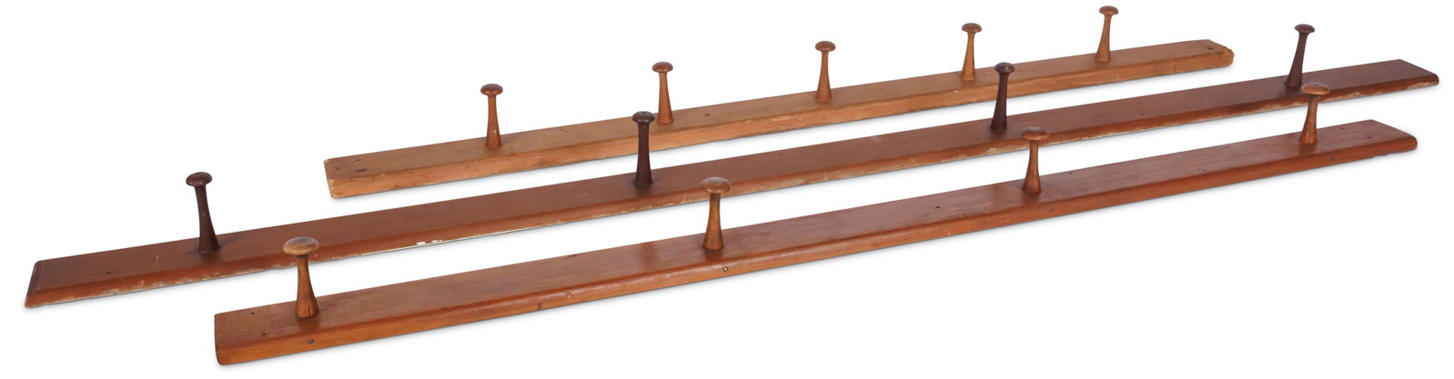 Three Shaker Peg Rails (Eastern community, ca. 1840) Longest: 64 1/4 in. (163.2 cm.), Shortest: 46: Three Shaker Peg Rails (Eastern community, ca. 1840) Each made of pine. Longest with pegs protruding through the backboard, in attic finish; middle in red stain, inscribed "Albert Hand" on the reverse