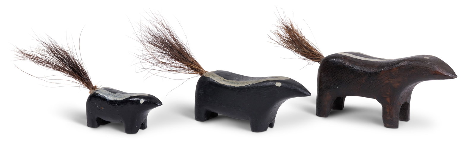 Group of Three Carved Miniature Skunks [Folk Art] largest 1 1/2 x 1 x 4 1/2 in. (3.8 x 2.5 x 11.4: Group of Three Carved Miniature Skunks [Folk Art] Hand-carved and painted with horsehair tails, American, 20th century. From the collection of Bruce and Doranna Wendel. largest 1 1/2 x 1 x 4 1/2 in. (