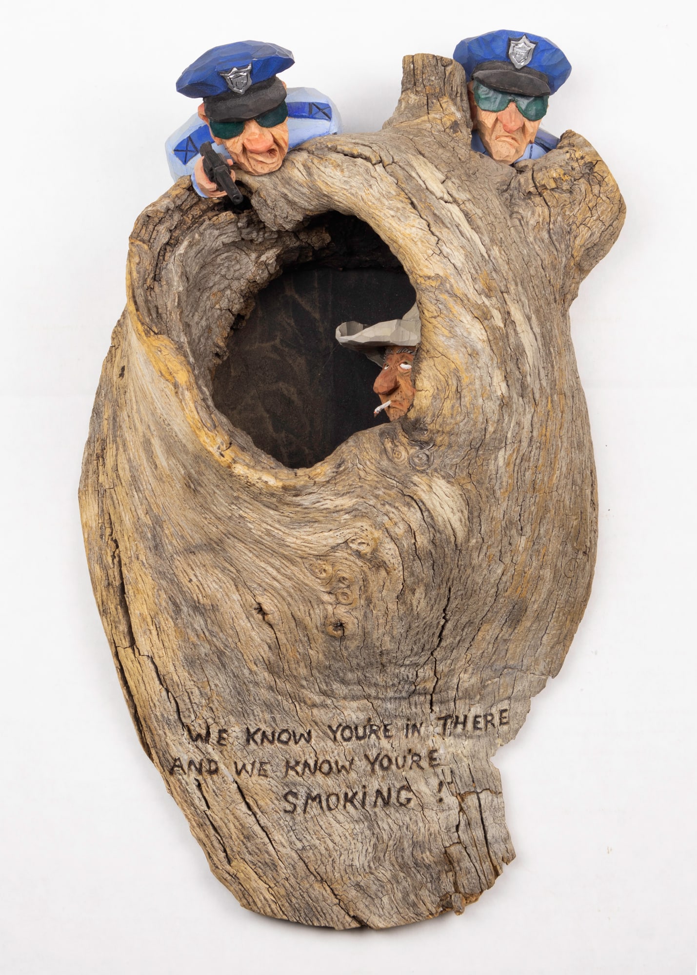 Gene Zesch (1932- ), We Know You're in There and We Know You're Smoking!: Gene Zesch (1932- ) We Know You're in There and We Know You're Smoking! Medium: wood Dimensions: 14 x 7 3/4 x 3 7/8 Signature inscribed: We Know You're in There and We Know You're Smoking! Provenance