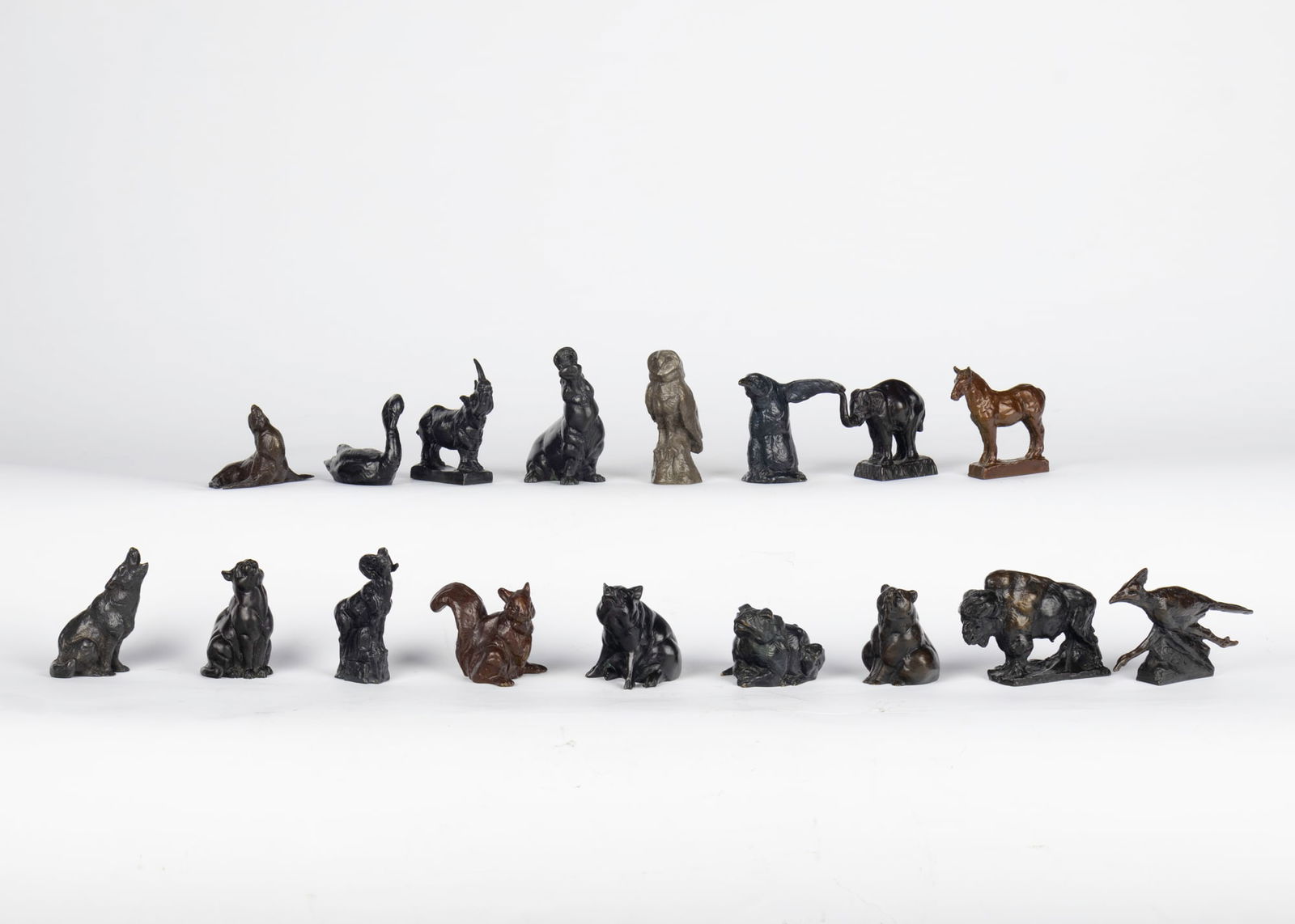 Dan Ostermiller (1956- ), Group of 17 Miniature Bronzes: Dan Ostermiller (1956- ) Group of 17 Miniature Bronzes Medium: bronze Dimensions: Owl: 3 1/4 x 1 /2 x 1 5/8 Howling Wolf, 2011: 2 3/4 x 1 1/2 x 2 3/8 Seated Cougar, 1996: 2 1/2 x 1 3/4 x 1 5/8 Seated