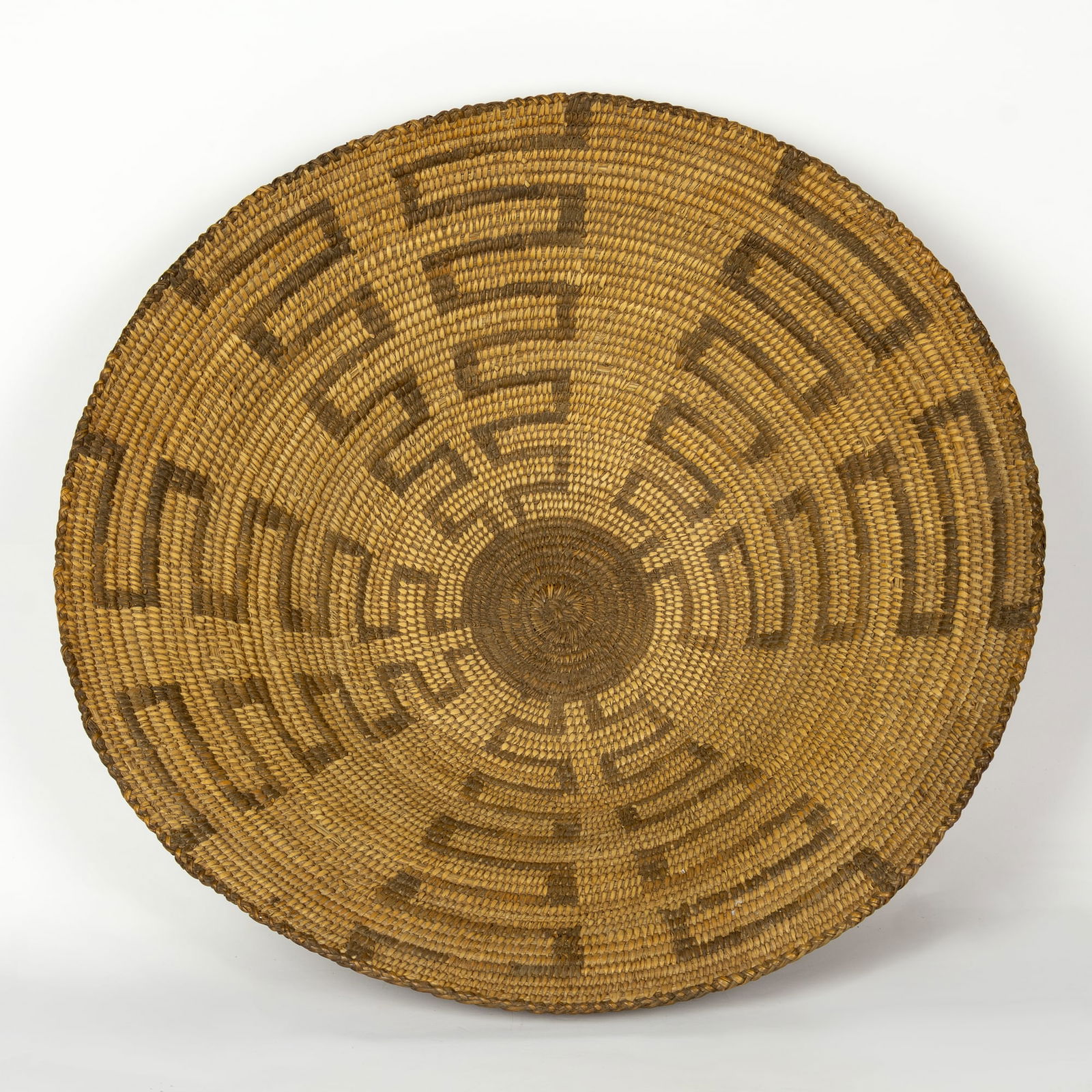 Unknown (20th Century): Pima Basketry Tray with Maze Design, c. 1900: Unknown (20th Century): Pima Basketry Tray with Maze Design, c. 1900 Medium: natural fibers Dimensions: 16 1/2 x 17 x 4 3/4 Provenance: From a Private Collection