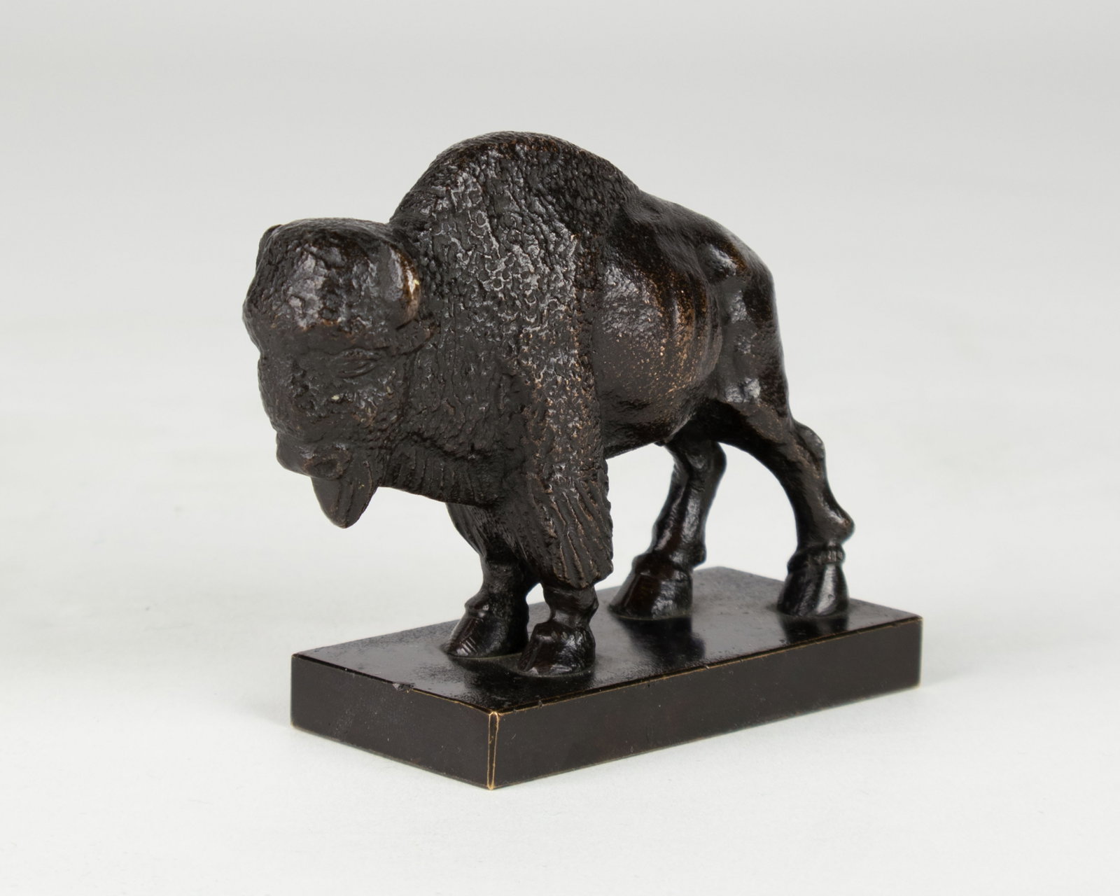 Simon Moselsio, Figure of a Buffalo, 1929: Simon Moselsio 1890-1964 Figure of a Buffalo, 1929 bronze stamped underside: © MOSELSIO 1929 stamped on base: © MOSELSIO 1929 modeled in 1929 3 x 3 3/4 x 1 1/2 in. Provenance: Private