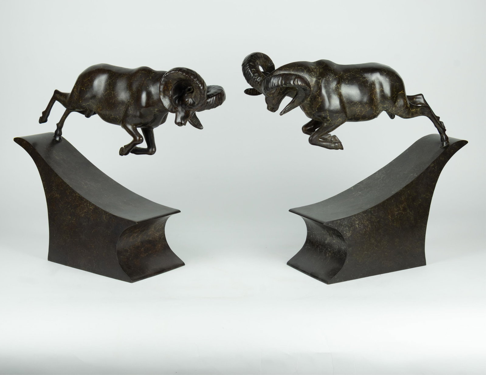 Simon Gudgeon, Battering Rams: Simon Gudgeon b.1958 Battering Rams bronze, edition 1 of 9 stamped: SG I/IX (each) (1) 20 3/4 x 22 1/4 x 7 1/4 in., (2) 19 3/4 x 23 x 7 in. Provenance: From a Private Collection P