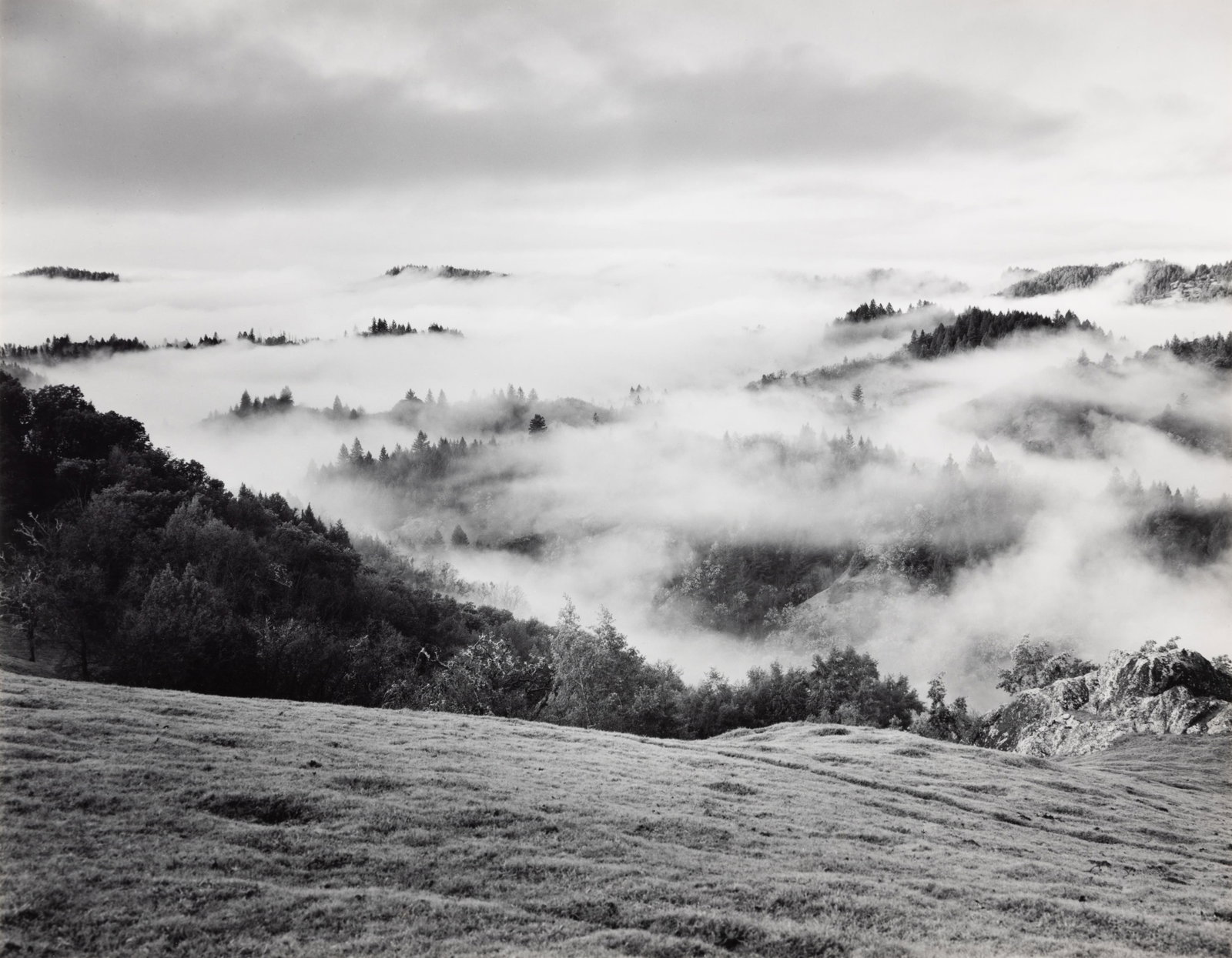 Ansel Adams, Clearing Storm, Sonoma County Hills, 1951: Ansel Adams 1902-1984 Clearing Storm, Sonoma County Hills, 1951 gelatin silver print, printed early 1960s signed lower right: Ansel Adams verso: titled 8 7/8 x 11 3/8 in., Mount: 14 x 18 in., Frame: 1