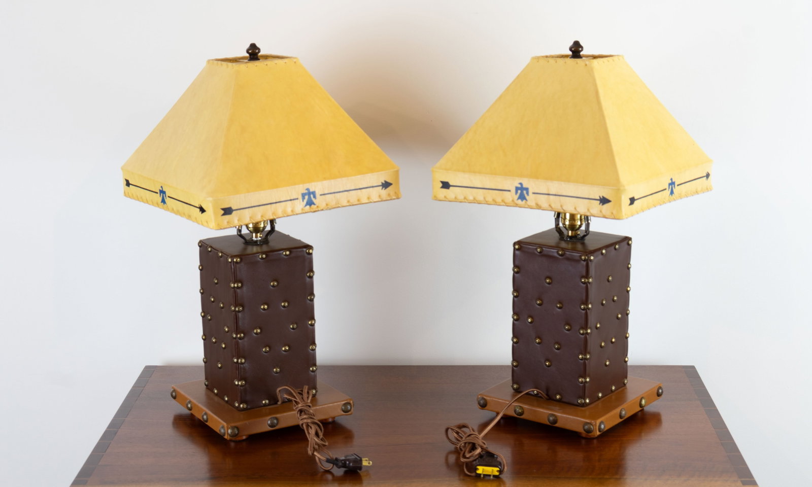 Thomas Molesworth, Pair of Leather-Wrapped Lamps with Brass Tack Decoration and Rawhide Shades, c.: Thomas Molesworth 1890-1877 Pair of Leather-Wrapped Lamps with Brass Tack Decoration and Rawhide Shades, c. 1950s maple plywood, leather, brass tacks, rawhide 22 x 12 x 12 in. (each) Provenance: Zach