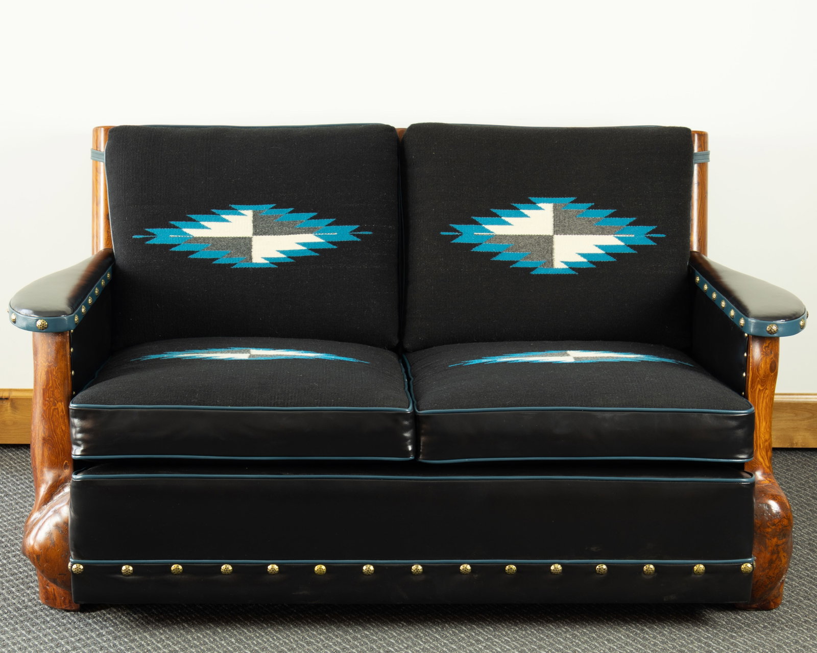 Thomas Molesworth, Burled Loveseat with Routed Side Panels, c. 1947: Thomas Molesworth 1890-1877 Burled Loveseat with Routed Side Panels, c. 1947 inland fir, tulip poplar, Chimayo wavings, leather, brass tacks 32 1/2 x 57 x 38 in. Provenance: Ryan's Cerro Ranch,