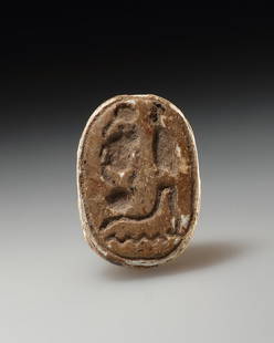 AN EGYPTIAN FAIENCE SCARAB BEAD: "