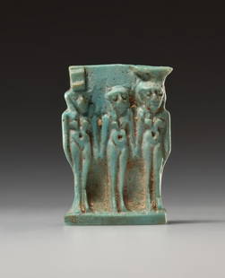 AN EGYPTIAN FAIENCE AMULET OF THE TRIAD: "