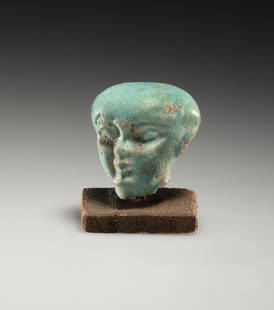 AN EGYPTIAN FAIENCE HEAD OF PTAIKOS: "