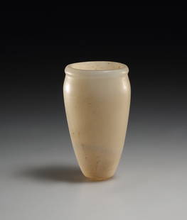 AN EGYPTIAN ALABASTER OINTMENT VESSEL: "