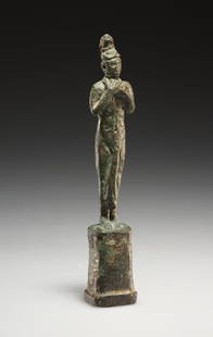 AN EGYPTIAN BRONZE STATUETTE OF PHTHONOS: "