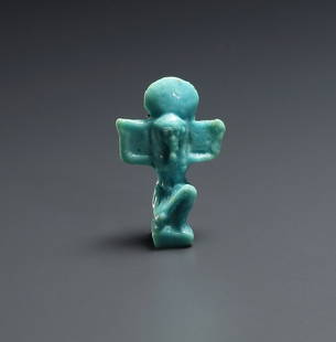 AN EGYPTIAN FAIENCE AMULET OF THE GOD SHU: "