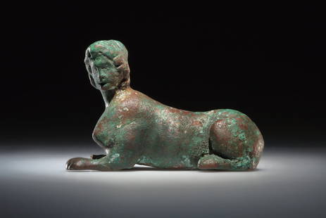 A HELLENISTIC OR ROMAN BRONZE STATUETTE OF A SPHINX: "