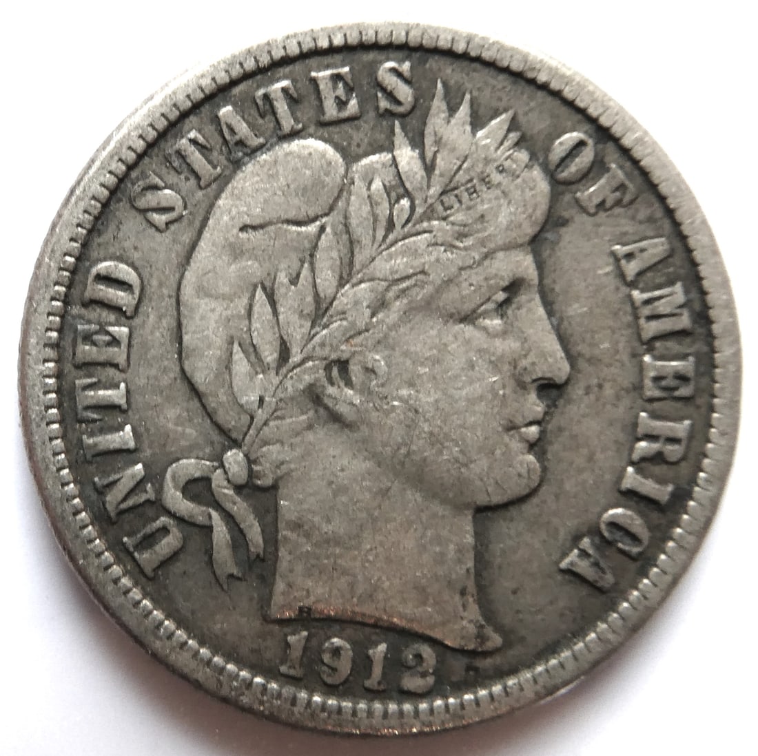 1 Dime 1912 UNITED STATES Silver Barber: CountryUSADenomination1 dimeYear1892-1916SubjectBarber DimePeriodUnited States of America (1909 - 1950)Coin typeCirculation coinsCompositionSilver 0.900Edge typeReededShapeRoundAlignmentCoin (180Â°)