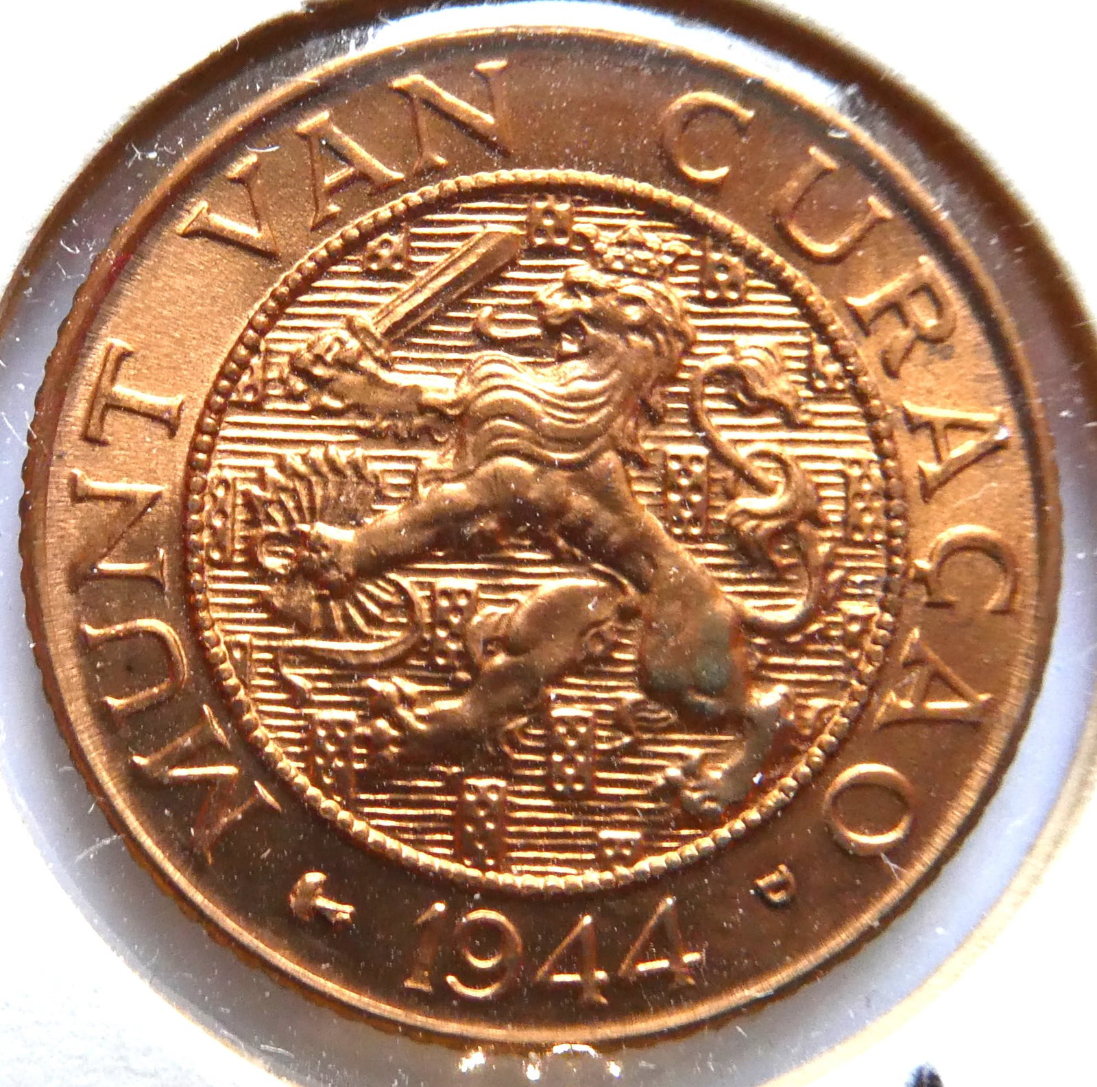 CuraÃ§ao 1 cent, 1944: IssuerCuraÃ§ao (Netherlands Antilles) QueenWilhelmina (1890-1948)TypeStandard circulation coinYears1944-1947Value1 Cent (0.01 ANG)CurrencyGulden (1828-date)CompositionBrass (95% Copper, 5% Zinc)Weig