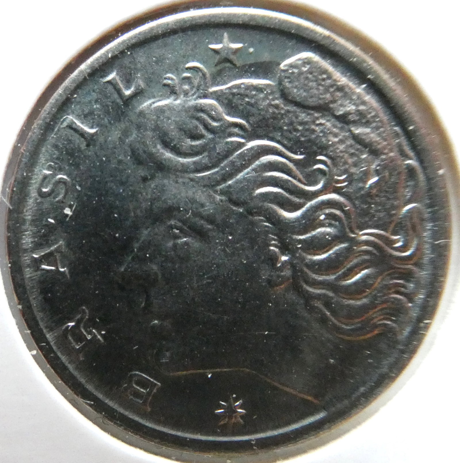 1969 - 5 Centavos Stainless Steel Coin - Liberty head: CountryBrazilDenomination5 centavosYear1969-1975PeriodBrazilian Cruzeiro (1942 - 1986)Coin typeCirculation coinsCompositionStainless SteelEdge typeSmoothShapeRoundAlignmentCoin (180Â°)Weight (gr)2.7