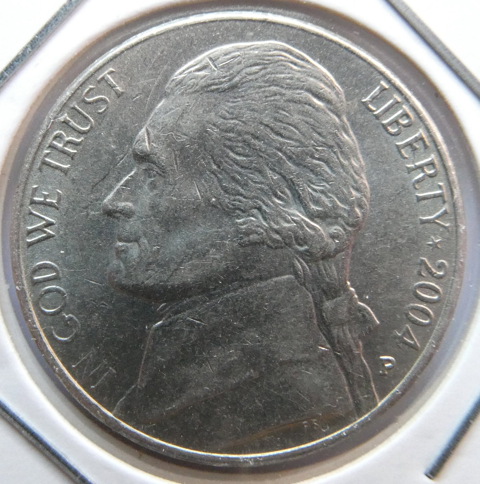 2004-P Jefferson nickel: modern Jefferson Nickel, it weighs 5 grams (0.176 ounces). It has a diameter 21.21 millimeters and it's composed of 75% copper and 25% nickel.