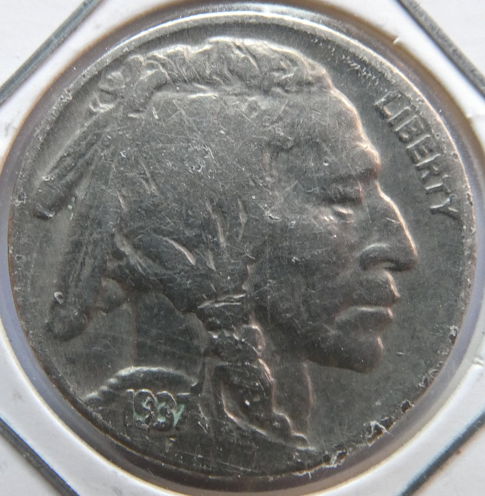 1937 Buffalo Nickel: There is no silver in The Buffalo nickels minted from 1913 to 1938. Those coins were a mixture of copper and nickel. Buffalo nickels do not contain silver content. The composition of a Buffalo nickel 