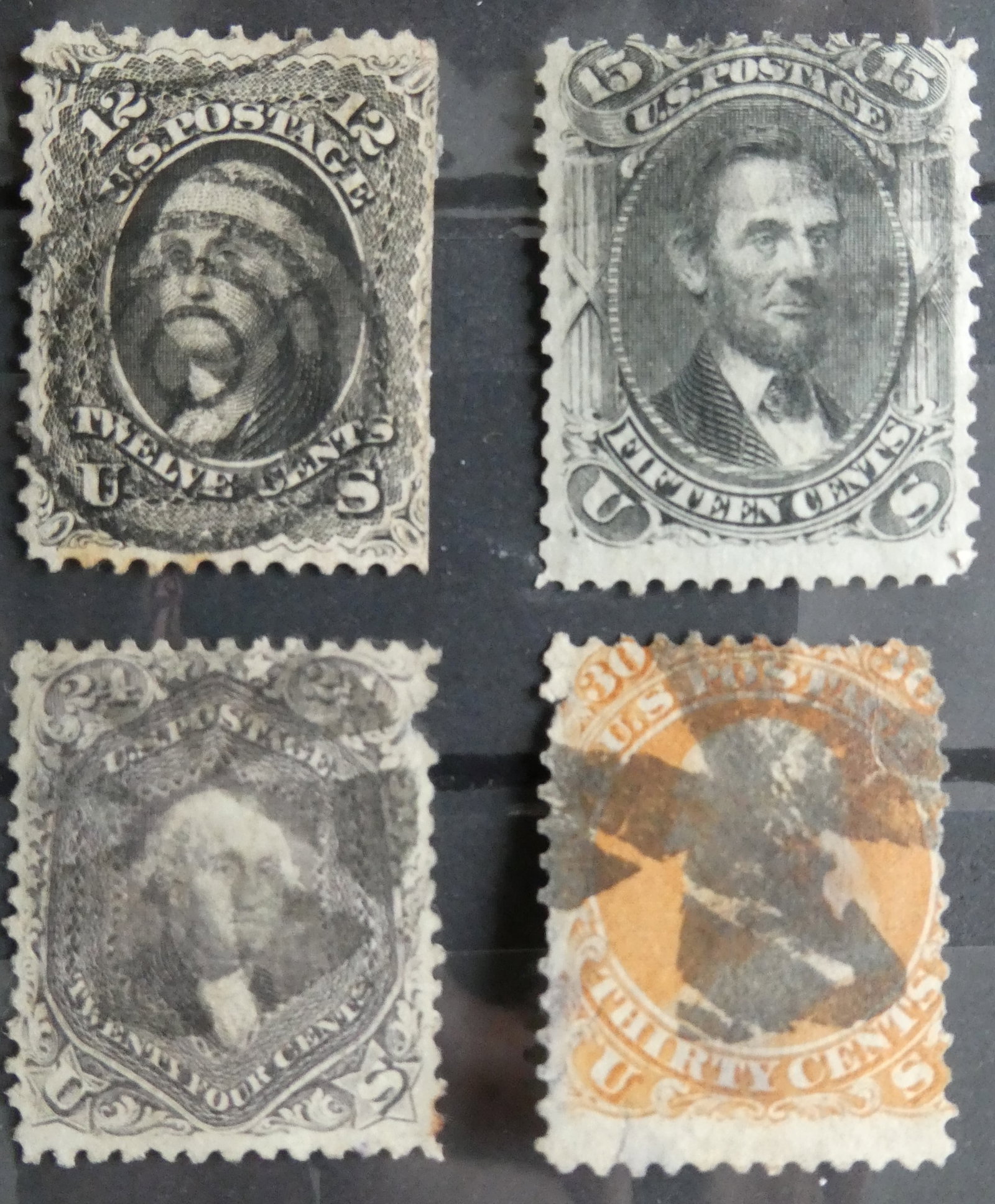 1861-66, 15 cent Lincoln - black 30 cent Franklin - orange 12 cent Washington 24 cent Washington: After the outbreak of the Civil War the government declared the existing stamps invalid for postage and quickly issued redesigned stamps. The designs of this series are similar enough to the old desig