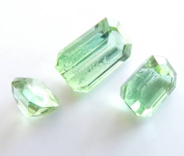 Lot of 3 Natural Green Tourmalines, Rectangular Cut, Afghanistan, 4.60 ct: This lot consists of three natural green tourmalines originating from Afghanistan, collectively weighing 4.60 carats. Each stone is cut in a rectangular step-cut (emerald-style), enhancing the clarity