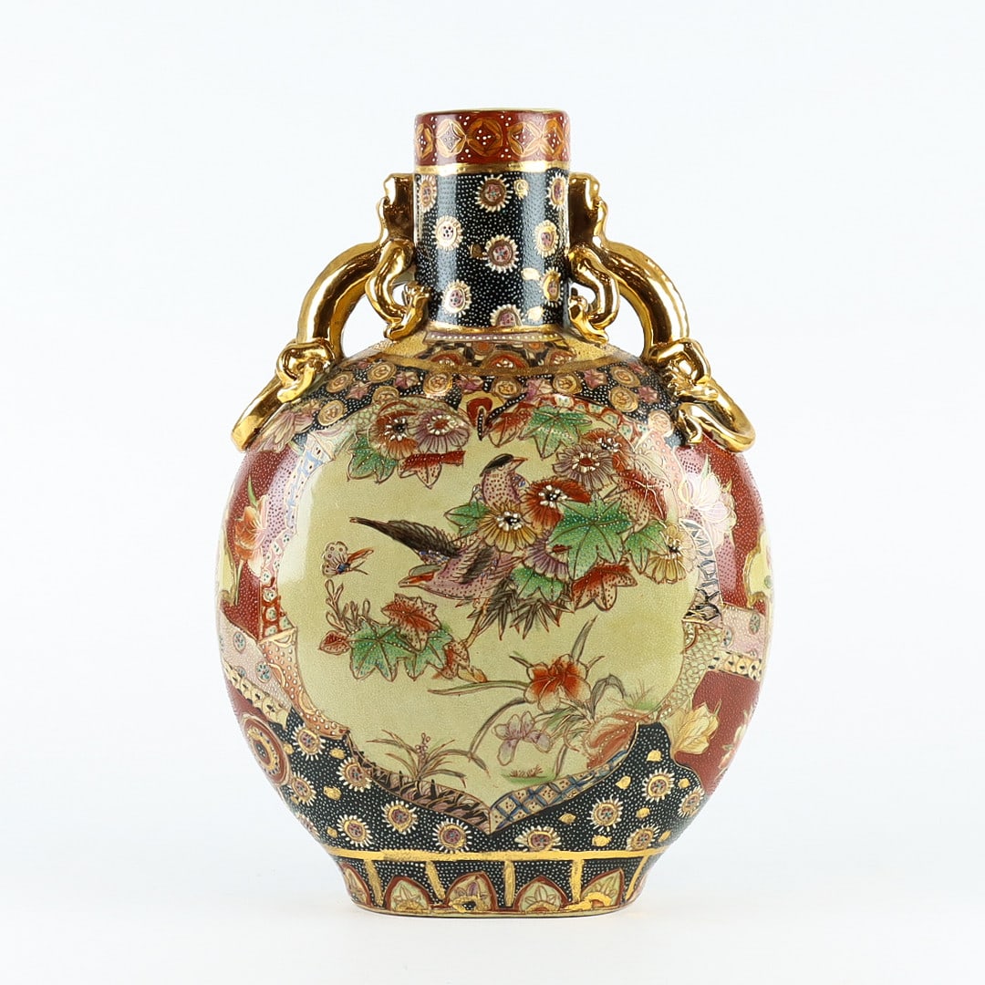 Japanese Satsuma-style moon flask with floral and bird decoration, c. 1900: A decorative Japanese Satsuma-style moon flask from the early 20th century, standing 36 cm tall. The body features an intricate polychrome enamel and gilt decoration of birds among chrysanthemums and